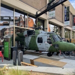 Helicopter going through h automatic sliding doors at the National Army Museum, London